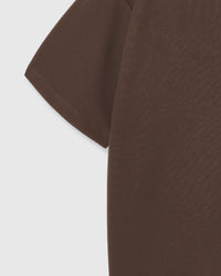 Close-up of sleeve and fabric on brown Hug-Me Bear T-Shirt showing cotton weave