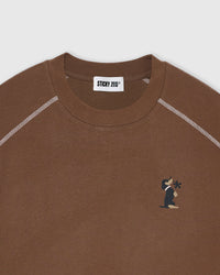 Back view showing dachshund bloom composition with floral graphics and typography on brown cotton