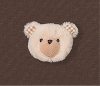 Styled arrangement showing Check-Ear tee plush detail and checkered ear close-up