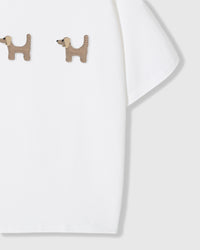 Detail of two houndstooth plush dachshunds on white Dachshund Trio T-Shirt near hem showing 3D texture