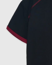 Model wearing STICKYZOO Dachshund Bloom Ringer in black showing oversized proportions and ringer trim