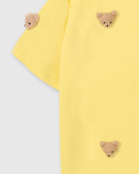 Back view of STICKYZOO lemon t-shirt showing clean boxy silhouette and double-stitched seams