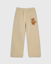 STICKYZOO TEDDY BEAR SWEATPANT in Cream featuring one hand-stitched plush teddy bear appliqué, designed in Amsterdam