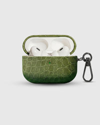 Olive Croc case open with AirPods Pro seated inside, croc-embossed lid visible