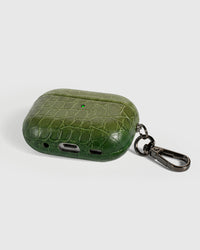 Back view of olive croc case showing USB-C port, speaker cutouts, and metal carabiner