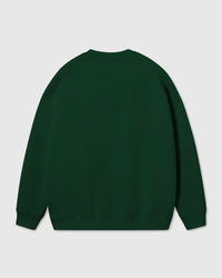 Back view of forest green Gingerbread Joy Sweatshirt showing clean back panel and ribbed cuffs