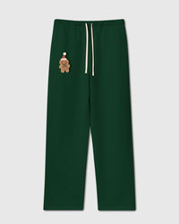 STICKYZOO Gingerbread Joy Sweatpant in forest green with one hand-stitched plush gingerbread man — front flat-lay