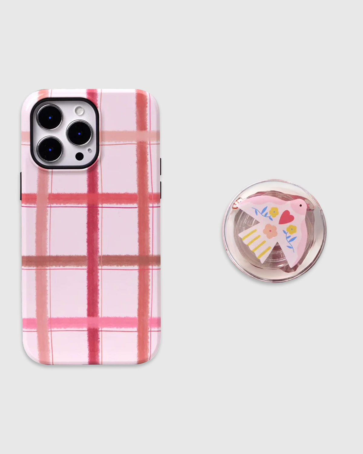 The Pink Plaid Bird Phone Case by Sticky Zoo® features a soft pink plaid design paired with a delicate bird charm for a gentle, romantic everyday look. – STICKY ZOO® The Pink Plaid Bird Phone Case by Sticky Zoo® features a soft pink plaid design paired with a delicate bird charm for a gentle, romantic everyday look. – STICKY ZOO®