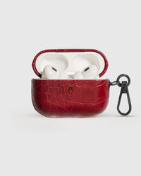 Wine Croc case open with AirPods Pro seated inside, croc-embossed lid visible