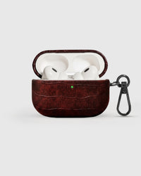 Burgundy vintage croc case open with AirPods Pro seated inside