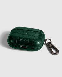Back view of emerald vintage croc case showing USB-C port, speaker cutouts, and metal carabiner