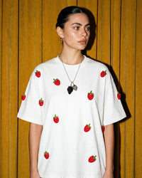 Model wearing STICKYZOO Strawberry T-Shirt in white showing oversized silhouette
