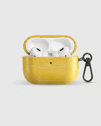 Citron Croc case open with AirPods Pro seated inside, croc-embossed lid visible