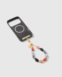 Inside view of a phone case showing the included Phone Strap Card that lets the strap work with any phone case.