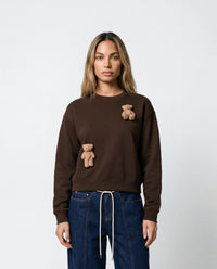 Model wearing dark brown Saint Teddy Bear Sweatshirt showing relaxed fit and plush detail