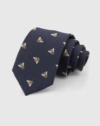 100% mulberry silk STICKYZOO Honeybee Tie in navy with hand-embroidered gold and white bee motifs, rolled to show silk sheen and embroidery detail
