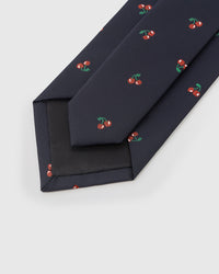 Hand-finished interior Cherry Tie back view showing structured interlining and tipping with embroidered cherry pattern on navy silk