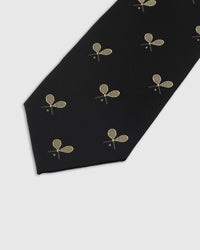 Embroidered, not printed STICKYZOO Racquet Tie flat blade showing repeating gold crossed racquet motifs on black herringbone silk