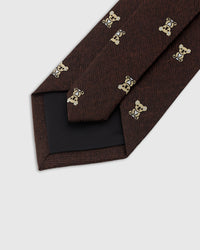 Hand-finished interior Ember Koala Tie back view showing structured interlining and tipping on dark burgundy silk