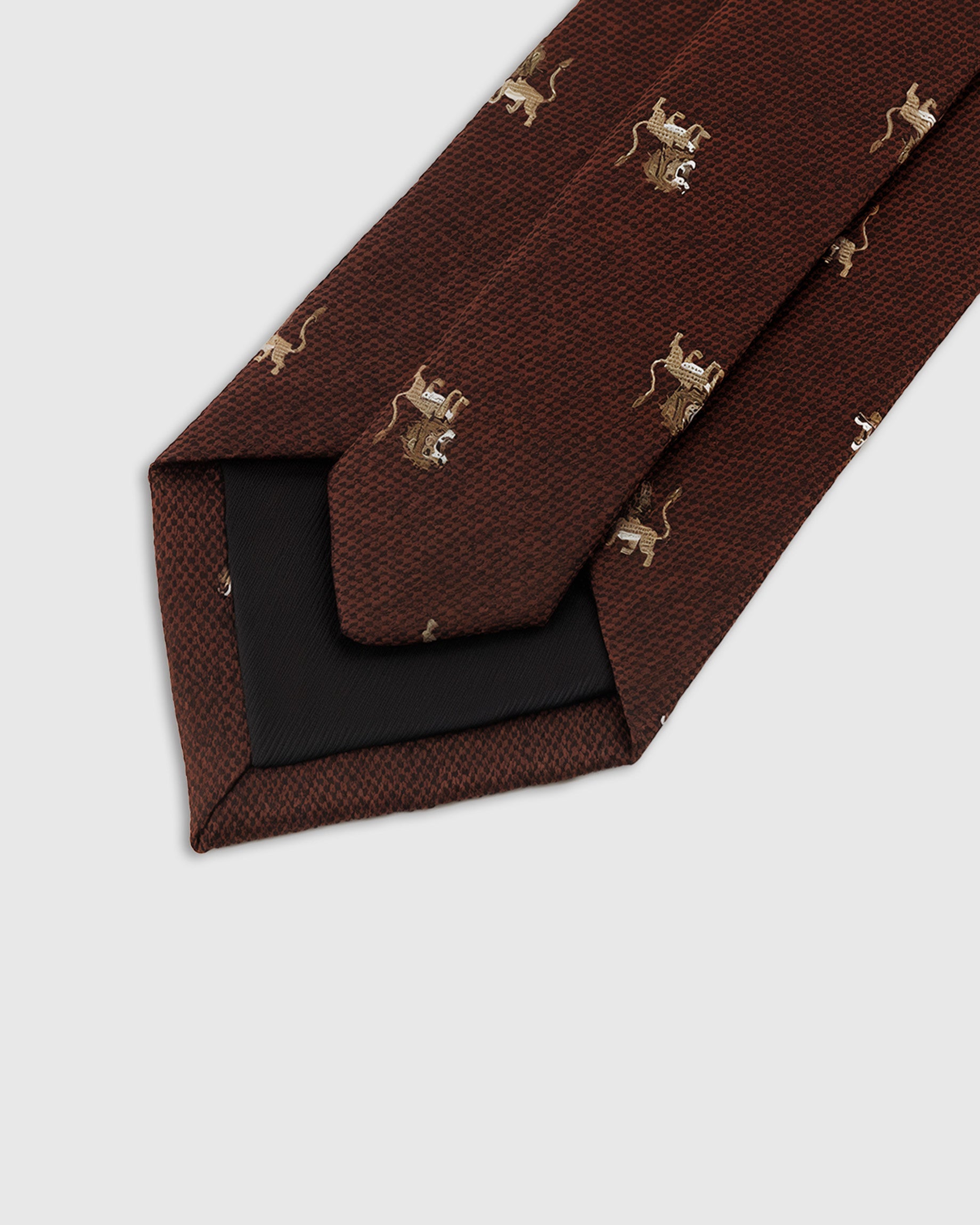 Hand-finished interior Regal Lion Tie back view showing structured interlining and tipping on oxblood mulberry silk