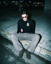 Model wearing black Saint Teddy Bear Sweatshirt showing fit and dropped shoulder detail
